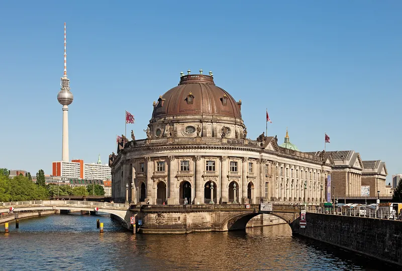 The Museum Island in Berlin seen across the Spree, with the Fernsehturm behind it.