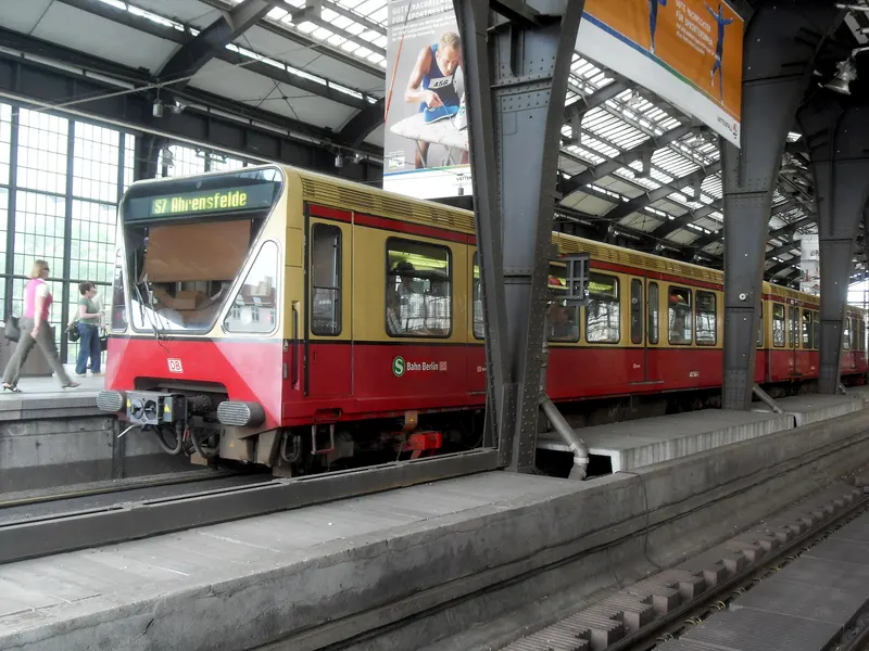 A Berlin S-Bahn train at a platform in Friedrichstraße station.